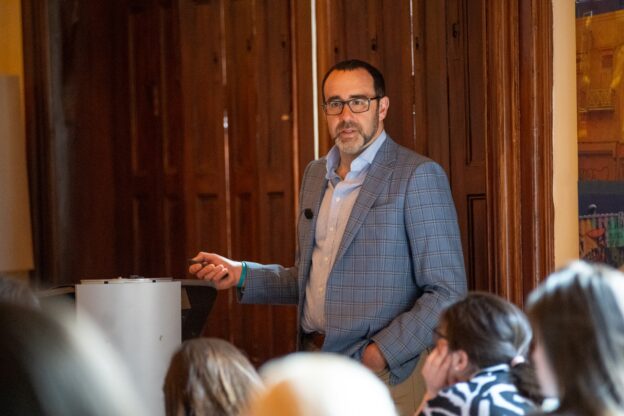 Chris Long speaking at podium