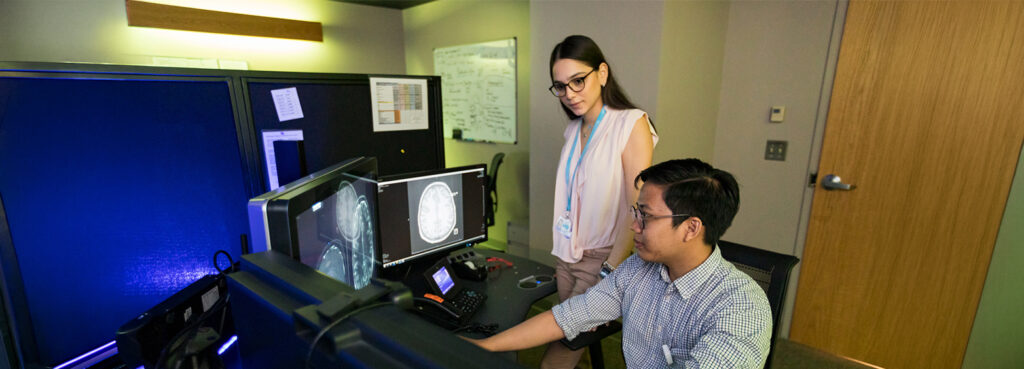two students in a radiology lab
